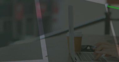 Animation of data processing over hands using laptop. Global business and digital interface concept digitally generated video.