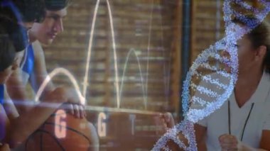 Animation of graphs and dna over diverse teenage basketball team and female trainer. Basketball, sport, school team and technology concept digitally generated video.