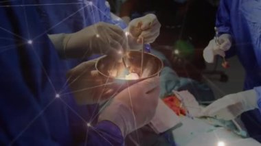 Animation of glowing network of connections over team of surgeons performing operation at hospital. Medical healthcare and technology concept