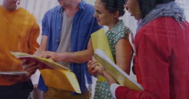 Animation of statistical data processing over diverse colleagues discussing over documents at office. Business data and analytics technology concept