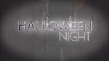 Animation of halloween night text over ghost on black background. Halloween, tradition and celebration concept digitally generated video.