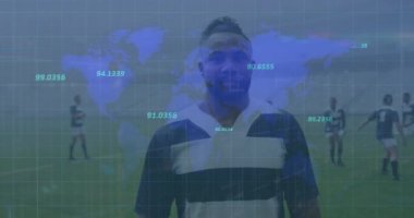 Animation of numbers over world map against african american male rugby player on sports field. Sports and fitness technology concept