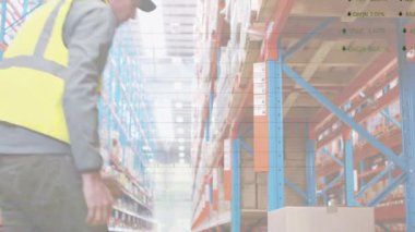 Animation of statistical data processing over caucasian male worker carrying a box at warehouse. Logistics business and technology concept