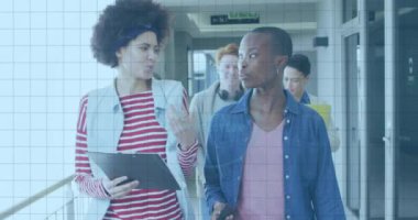 Animation of fingerprint scanning over multiracial colleagues discussing, walking in office corridor. Digital composite, multiple exposure, creative business, teamwork, modern office, accessibility.