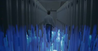 Animation of glowing blue light trails over rear view of male engineer walking in server room. Business storage technology concept