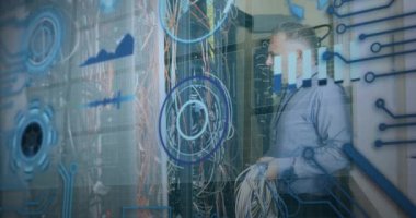 Animation of interface with data processing over caucasian male engineer working at server room. Computer interface and business data storage technology concept