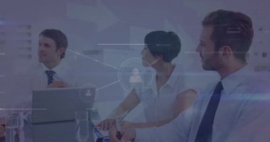 Animation of profile icons connecting with lines over multiracial coworkers discussing in office. Digital composite, multiple exposure, communication, business, teamwork, office and technology,
