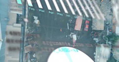 Animation of statistical data processing over aerial view of scrap at junkyard. Recycling and business data technology concept
