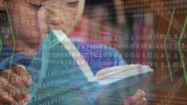 Animation of qr code and binary data processing over asian schoolboy reading in library. Global communication, education, data sharing and digital interface concept digitally generated video.