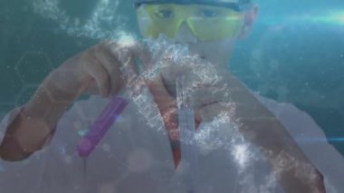Animation of pulsating circle and dna structure over caucasian boy pouring chemical in test tubes. School and education concept