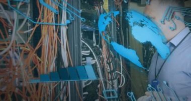 Animation of interface with data processing over caucasian male engineer working at server room. Computer interface and business data storage technology concept