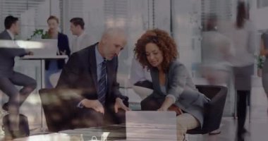 Animation of timelapse with people over diverse coworkers using laptop in office. Business, working in office with technology concept digitally generated video.