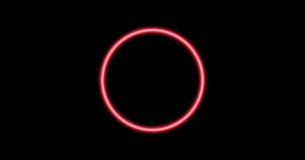 Image of glowing pink circle over black background. Colour and movement concept digitally generated image.