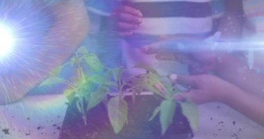 Animation of light trails over diverse schoolchildren holding plants. Global education and learning concept digitally generated video.
