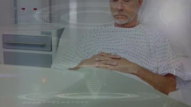 Animation of medical data processing over caucasian senior male patient in hospital bed. Medical healthcare and technology concept