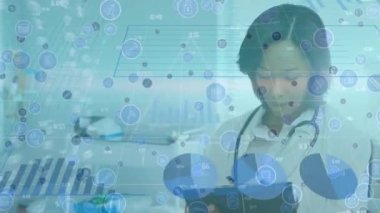 Animation of triangle shape over diverse female doctor and health worker examining x-ray report. Medical healthcare and technology concept