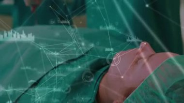 Hastanede ameliyat yapan cerrah ekibi üzerinden bağlantı ağının animasyonu. Tıbbi sağlık ve teknoloji konsepti