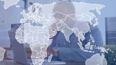Animation of world map over african american businessman using laptop and talking on smartphone. Business data and analytics technology concept