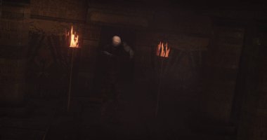 Image of scary zombie mummy walking around in dark crypt room with burning torches. Halloween fear, horror and suspense concept digitally generated image.