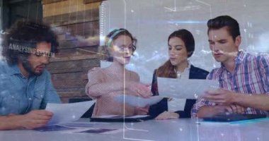Animation of data processing over diverse colleagues discussing over documents at office. Business data and analytics technology concept