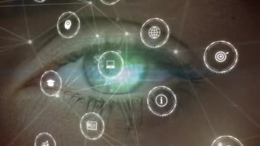 Animation of network of connections with icons over eye of caucasian woman. Global technology, computing and digital interface concept digitally generated video.