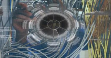 Animation of interface with data processing over caucasian male engineer working at server room. Computer interface and business data storage technology concept