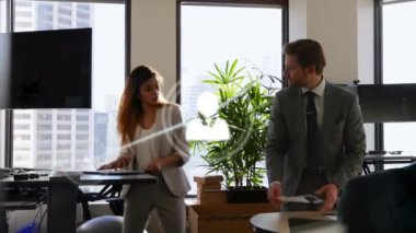 Animation of profile icons connecting with lines over multiracial colleagues discussing reports. Digital composite, multiple exposure, teamwork, document, telecommunication and office concept.