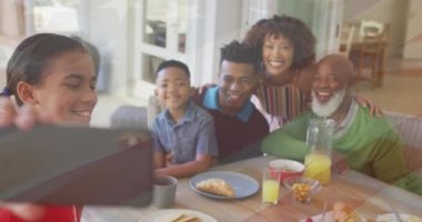 Animation of flag of usa over african american family taking selfies. Patriotism and celebration concept digitally generated video.