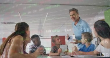 Animation of trading board over male teacher showing digital pc to multiracial students in classroom. Digital composite, multiple exposure, investment, education, e-learning, technology concept.