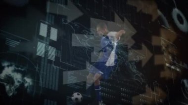 Arrow icons and interface with data processing over caucasian male soccer player kicking the ball. Computer interface and sports technology concept