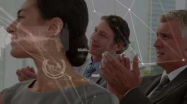 Animation of network of connections with data processing over diverse business people. Global business, connections and digital interface concept digitally generated video.