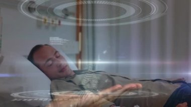 Animation of medical data processing over caucasian male and female patient in hospital bed. Medical healthcare and technology concept