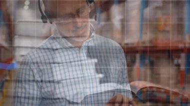 Animation of statistical data processing over caucasian senior male supervisor using digital tablet. Logistics business and technology concept