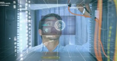 Animation of round scanner and data processing over caucasian male engineer working at server room. Computer interface and business data storage technology concept