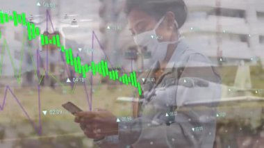 Animation of financial data processing over african american woman wearing face mask. Global covid 19 pandemic, finances and digital interface concept digitally generated video.