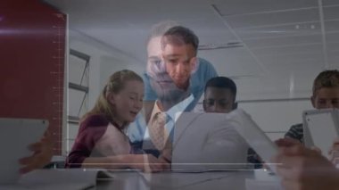 Animation of businessman touching futuristic screen against male teacher and students using computer. Global business and education technology concept
