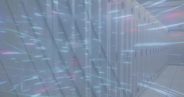 Animation of glowing blue light trails spinning over empty computer server room. Global networking and business storage technology concept