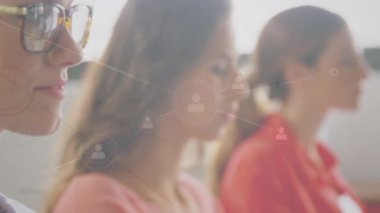 Animation of network of profile icons over portrait of caucasian woman smiling at office. Global networking and business technology concept