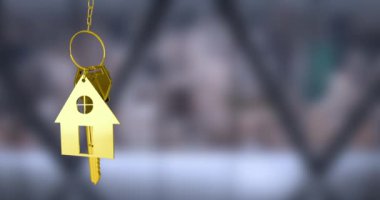 Animation of golden house keys hanging against blurred background with copy space. Relocation and real estate concept