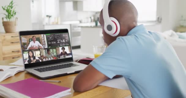 Video African American Boy Headphones Having Online Lessons Laptop Homeschooling — Stockvideo