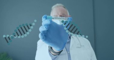 Animation of dna strands over caucasian male doctor wearing face mask holding tube with vaccine. Global medicine, science and digital interface concept digitally generated video.