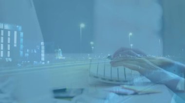 Animation of road over caucasian woman in office. Global business and digital interface concept digitally generated video.