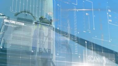 Animation of infographic interface, caucasian man working on laptop on entrance of windmill. Digital composite, multiple exposure, database, sustainable energy, wind power, business and technology.