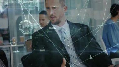 Animation of network of connections and data processing over business people. Global business, finance, networks and data processing concept digitally generated video.