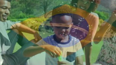 Animation of flag of brazil over african american family. Patriotism, family and digital interface concept digitally generated video.