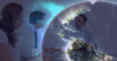 Animation of illuminated globe rotating over multiracial colleagues brainstorming in meeting. Digital composite, multiple exposure, global business, networking, teamwork and technology concept.