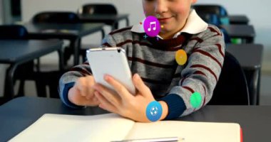 Animation of colorful icons over caucasian schoolboy using smartphone. Global social media, icons and digital interface concept digitally generated video.