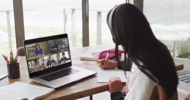 Video Middle Eastern Girl Headphones Having Online Lessons Laptop Homeschooling — Stockvideo