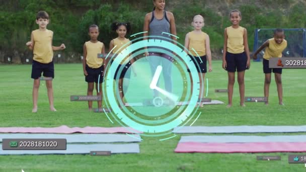 Animation Clock Notification Counter Multiracial Instructor Children Practicing Yoga Digital — Stockvideo