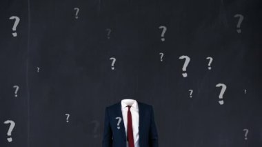 Animation of lightbulb with caucasian businessman over question marks on black background. Global education and digital interface concept digitally generated video.